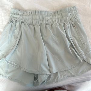 High rise track that mint Lululemon shorts. Size 6.